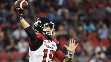 Calgary Stampeders quarterback Bo Levi Mitchell (19) passes against the Toronto Argonauts during first half CFL football action in Toronto on Thursday, August 3, 2017. THE CANADIAN PRESS/Nathan Denette mitchell-bo-170803-1180