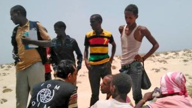 International Organization for Migration staff assist Somali and Ethiopian migrants who were forced into the sea by smugglers.