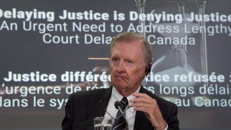 Sen. Bob Runciman, chair of the Senate committee on legal and constitutional affairs, listens to a speaker after releasing the committee's final report on court delays during a news conference in Ottawa on June 14. Court Delays 20170614