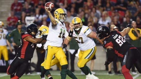 Edmonton Eskimos quarterback Mike Reilly passes against the Ottawa Redblacks during the first half in Ottawa on Thursday. eskimos-reilly-mike-081017-620