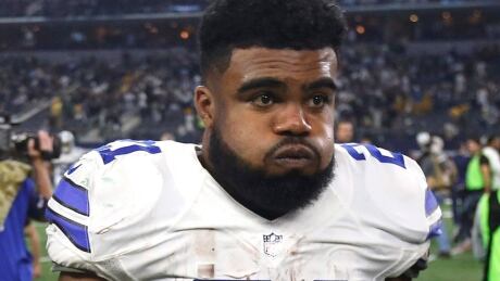 Dallas Cowboys' Ezekiel Elliott (21) walks off the field after a 34-31 loss to the Green Bay Packers in an NFL divisional playoff football game, in Arlington, Texas. Cowboys owner Jerry Jones says the club is still gathering details over Elliott's involvement in an altercation at a Dallas bar, the latest off-field incident for the star running back. Cowboys Elliott Football