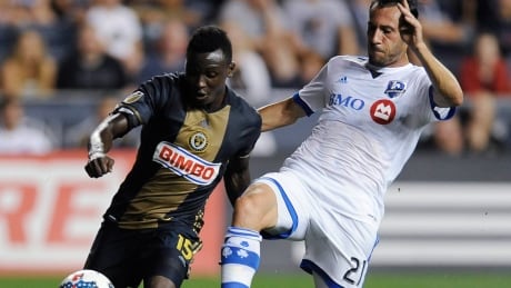 Philadelphia Union's Joshua Yaro, left, and Montreal Impact's Matteo Mancosu vie for the ball in the first half. union-impact