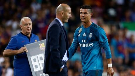 Real Madrid's Cristiano Ronaldo, right, reacts after referee Ricardo de Burgos showed a red card during a Spanish Super Cup match between FC Barcelona and Real Madrid on Sunday in Barcelona. ronaldo-cristiano-081417-620