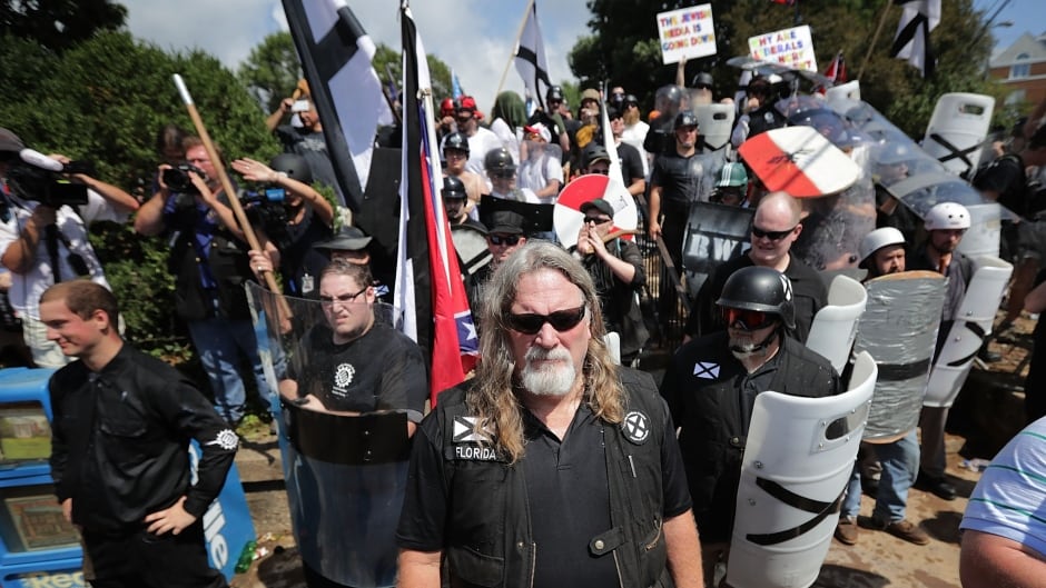 White nationalists, neo-Nazis and members of the 'alt-right' at the 'Unite the Right' rally, Aug. 12, 2017, in Charlottesville, Va. Former white supremacist Tony McAleer says this violent protest should be a wake up call to the U.S. and Canada.