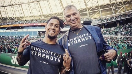 CFL Commissioner Randy Ambrosie and Saskatchewan Roughriders wide receiver Chad Owens show off the Diversity is Strength T-shirts Sunday. Commissioner Ambrosie Chad owens