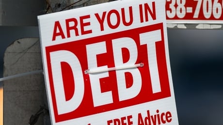 Photo taken of a debt sign in Toronto, Ontario on August 10, 2017. Debt sign