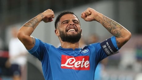 Napoli's Lorenzo Insigne celebrates after his teammate Jorginho scored the second goal during a Champions League playoff round against Nice on Wednesday. Italy Scoccer Champions League