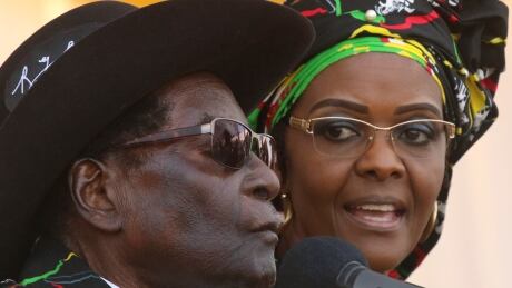 President Robert Mugabe and his wife Grace are shown at a rally in Zimbabwe on July 29. Grace Mugabe, accused of assaulting a 20-year-old woman, has been banned from leaving South Africa.
ZIMBABWE-MUGABE/