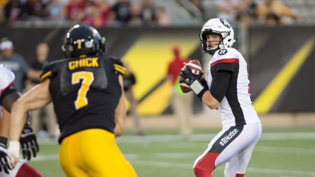 Quarterback Trevor Harris, right, of the Redblacks prepares to make a throw during Ottawa's 31-12 win over the Hamilton Tiger-Cats on Friday. FBO CFL Redblacks Tiger Cats 20170818