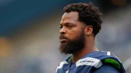 Michael Bennett of the Seattle Seahawks sat during the national anthem for the second straight preseason game. Bennett has said that his decision has been influenced by the violence in Charlottesville Va. Bennett-Michael-18082017
