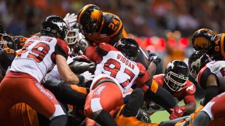 Jeremiah Johnson (24) of the BC Lions is stopped at the goal line during the Calgary Stampeders' 21-17 win on Friday. Lions-Stampeders-18082017