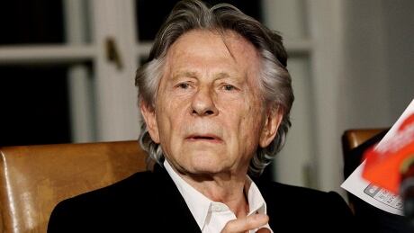 FILE - In this Oct. 30, 2015, file photo, filmmaker Roman Polanski tells reporters he can "breath with relief" after a Polish judge ruled that the law forbids his extradition to the U.S., where in 1977 he pleaded guilty to having sex with a minor, in Krakow, Poland. A Los Angeles judge has denied the impassioned plea of Roman Polanski's victim to end the criminal case against the fugitive director. Judge Scott Gordon ruled Friday, Aug. 18, 2017, Polanski must appear in a Los Angeles court if he expects to have his four-decade-old case resolved. Roman Polanski