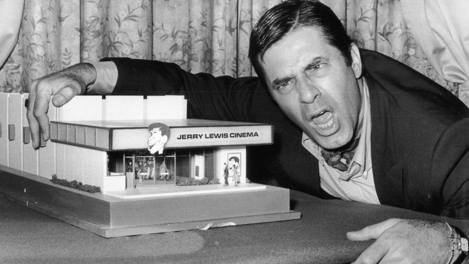 22nd April 1971: American comedian and film star Jerry Lewis with a model of the 'Jerry Lewis Cinema'.