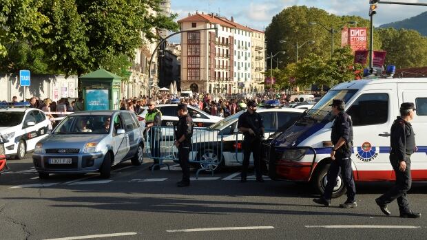 Police hunting terror suspect shoot dead man 'wearing explosive belt' in Barcelona