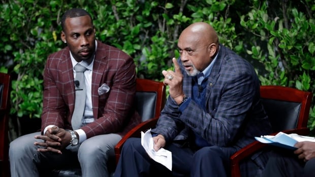 Anquan Boldin left listens as former U.S. Olympian Tommie Smith famous for his protest at the 1968 Olympics speaks at an activist panel in January
