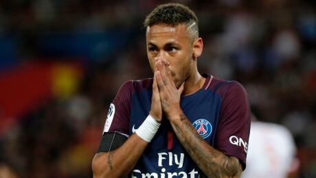 Brazilian forward Neymar is being sued his former Barcelona club for a 2016 bonus it wants repaid. AFP_RP84Q