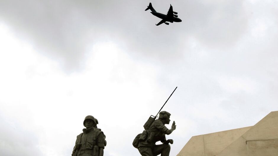 A Royal Canadian Air Force C-17 makes a fly past over the Peacekeeping Monument in Ottawa during a 2012 ceremony honouring fallen peacekeepers.