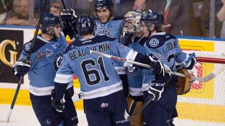 Rimouski Oceanics players Simon Bourque, from left, Francois Beauchemin, Guillaume McSween and Tyler Boland gather around winning goalie Philippe Desrosiers after he shut out Quebec Remparts 4-0, Wednesday, May 27, 2015 at the Memorial Cup in Quebec City. The Montreal Canadiens signed defence prospect Simon Bourque to a three-year entry level contract on Thursday. HKN Canadiens Bourque 20170309