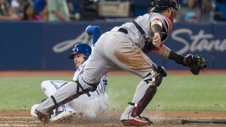 Red Sox catcher Christian Vazquez forces out Toronto Josh Donaldson at home plate during the fifth inning of Boston's 6-5 win Monday. BBA Red Sox Blue Jays 20170828