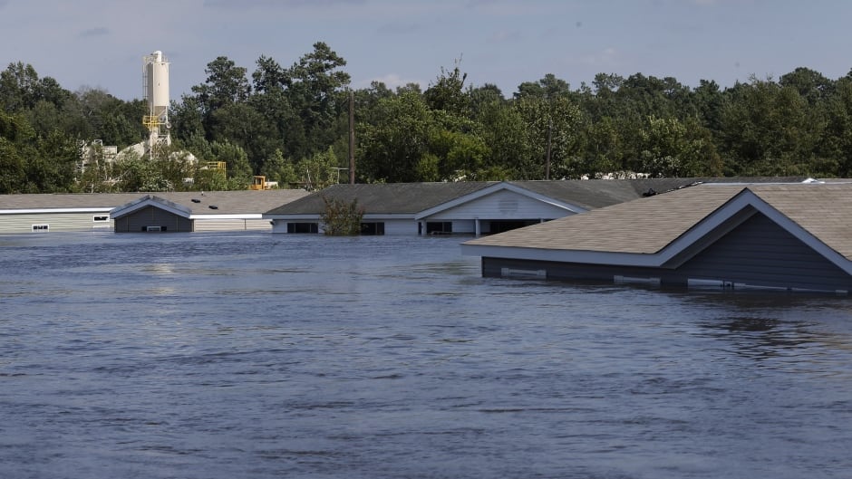 Submerged houses are seen by flood waters from Tropical Storm Harvey in Rose City, Texas.