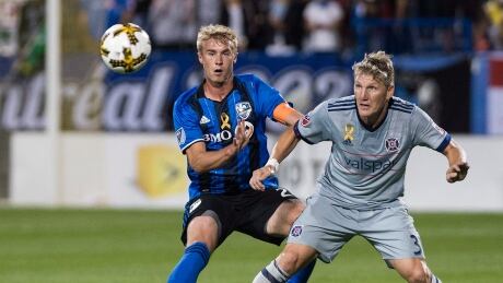 Bastian Schweinsteiger, seen holding Montreal's Kyle Fisher, scored the winner as the Chicago Fire defeated the Impact 1-0 on Saturday. Impact-fire-02092017