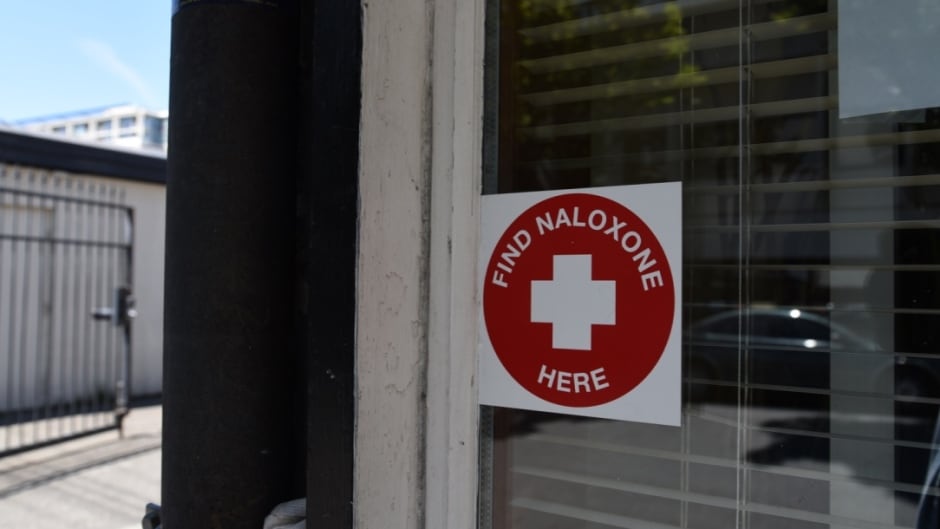 A sticker on the window of STS Pharmacy in downtown Victoria. Naloxone is a drug that can counteract an opioid overdose.