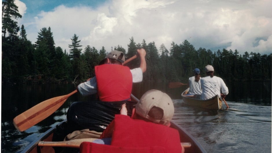 The Anderson family on a canoeing adventure in calmer waters.