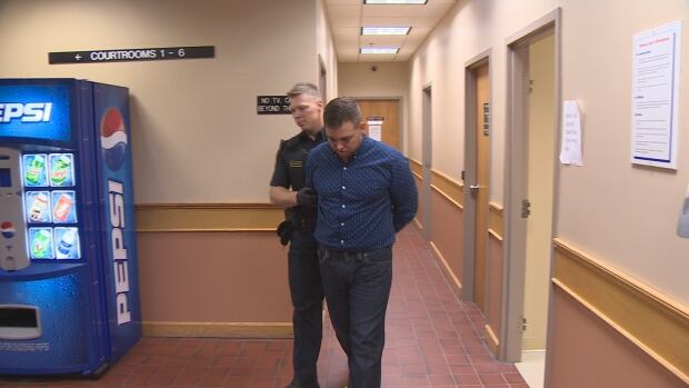 Craig Pope walking to court