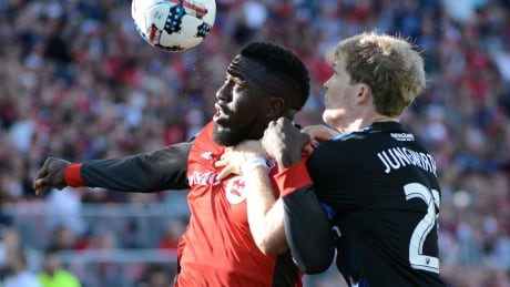 TFC's Jozy Altidore, seen left fending off Florian Jungwirth of the San Jose Earthquakes, scored a brace to help Toronto record its fifth straight victory on Saturday. TFC-Eathquakes-09092017