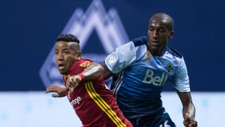 Aly Ghazal of the Whitecaps vies for the ball against Joao Plata of Real Salt Lake during MLS action on Saturday, in Vancouver. RSL-Whitecaps-09092017