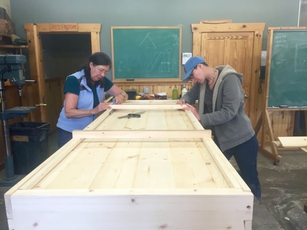 Libby and Sarah Hoops, working on their casket