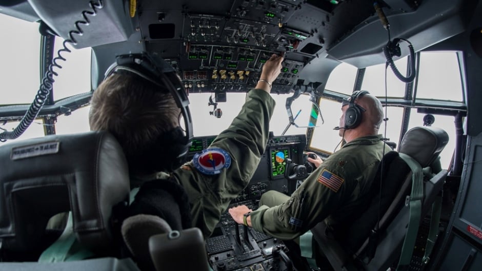 Air Force Reserve pilots Maj. Byron Hudgins, left, and Maj. Kendall Dunn, of the 53rd Weather Reconnaissance Squadron Hurricane Hunters, fly their WC-130J Super Hercules through Hurricane Irma, south of Florida, Sept. 10, 2017.