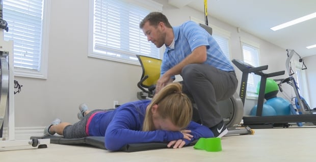 Heather Moyse with unidentified trainer/therapist in Summerside