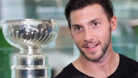 Pittsburgh Penguins' Kris Letang, with the Stanley Cup during a hospital visit this summer, has been cleared to play after having neck surgery in April that forced him to miss the playoffs. HKN Letang Montreal 20170723