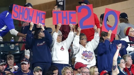 Cleveland Indians fans cheer for their team to win their 20th straight game on Tuesday during a game against Detroit. Tigers Indians Baseball