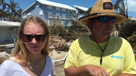 Mike Gilbert and his daughter Brooke in front of the family's crushed condo on Islamorada in the Florida keys. They've been visiting here for year, from their home in Fort Lauderdale, and can't believe the place is now gone. Mike Gilbert Islamorada Florida Keys Hurrican Irma