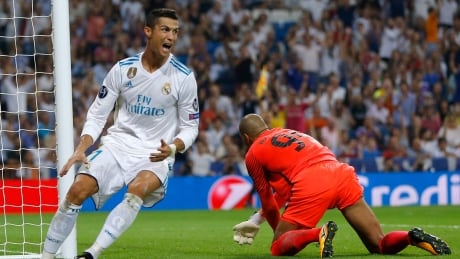 Real Madrid's Cristiano Ronaldo reacts after scoring on APOEL goalkeeper Boy Waterman during a Champions League match on Wednesday. ronaldo-cristiano