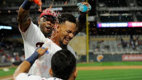 Byron Buxton, centre, hit a walk-off solo home run in the 10th inning as the Minnesota Twins defeated the Toronto Blue Jays 3-2 on Thursday evening. byron-buxton