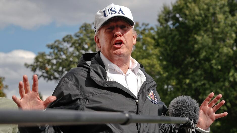 U.S. President Donald Trump speaks with the press.