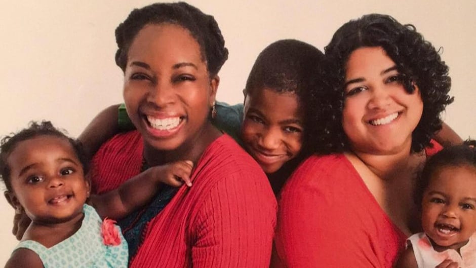 Nikkya Hargrove (left) (holding Lera De Silva), Jonathan De Silva (hugging moms), Dinushka De Silva (right) (holding Aviah De Silva)