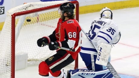 Ottawa's Mike Hoffman scores past Toronto's Curtis McElhinney during the Senators' 6-2 win Monday night in their preseason opener. HKN Maple Leafs Senators 20170918