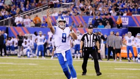 Detroit Lions quarterback Matt Stafford (9) throws a pass for a touchdown to tight end Eric Ebron during the first half. lions-giants