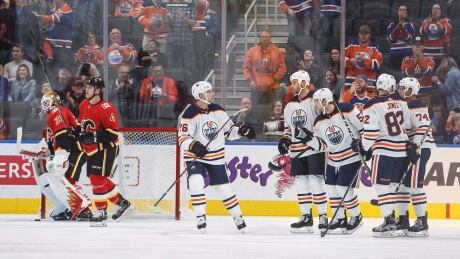 The Edmonton Oilers celebrate a goal against the Calgary Flames during first period. flames-oilers