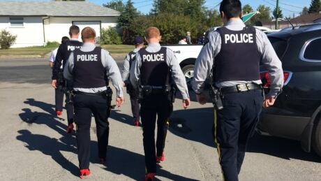 Six fully-uniformed RCMP officers participated in the Walk a Mile in Her Shoes event in Thompson, Man., over the weekend. Thompson police heels