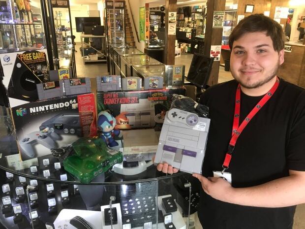 Ray Harris with games at PEI retailer Most Wanted