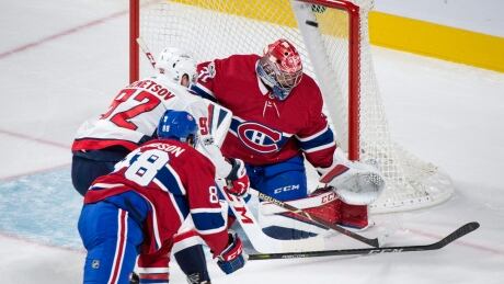 Washington Capitals' Evgeny Kuznetsov scores past Montreal Canadiens goalie Carey Price as he is followed by defenceman Brandon Davidson. capitals-canadiens