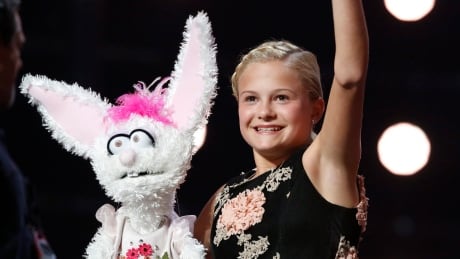 This Wednesday, Sept. 20, 2017 photo shows Darci Lynne Farmer on "America's Got Talent" in Los Angeles. The 12-year-old girl is getting a $1 million prize and her own Las Vegas show after taking the “America’s Got Talent” crown on the season 12 finale of the NBC reality competition Wednesday. (Trae Patton/NBC via AP) TV Americas Got Talent