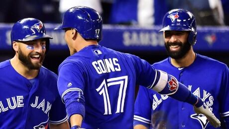 Ryan Goins of the Blue Jays celebrates with teammates Kevin Pillar, left, and Jose Bautista after hitting a grand slam in the sixth inning to help Toronto to a 8-1 win over the New York Yankees on Friday.
Goins-Ryan-22092017