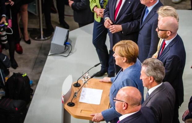 Angela Merkel speaks after exit polls