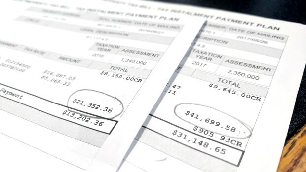 Many businesses outside downtown have seen a dramatic rise to their property tax bills. Calgary property tax documents are seen in this file photo.